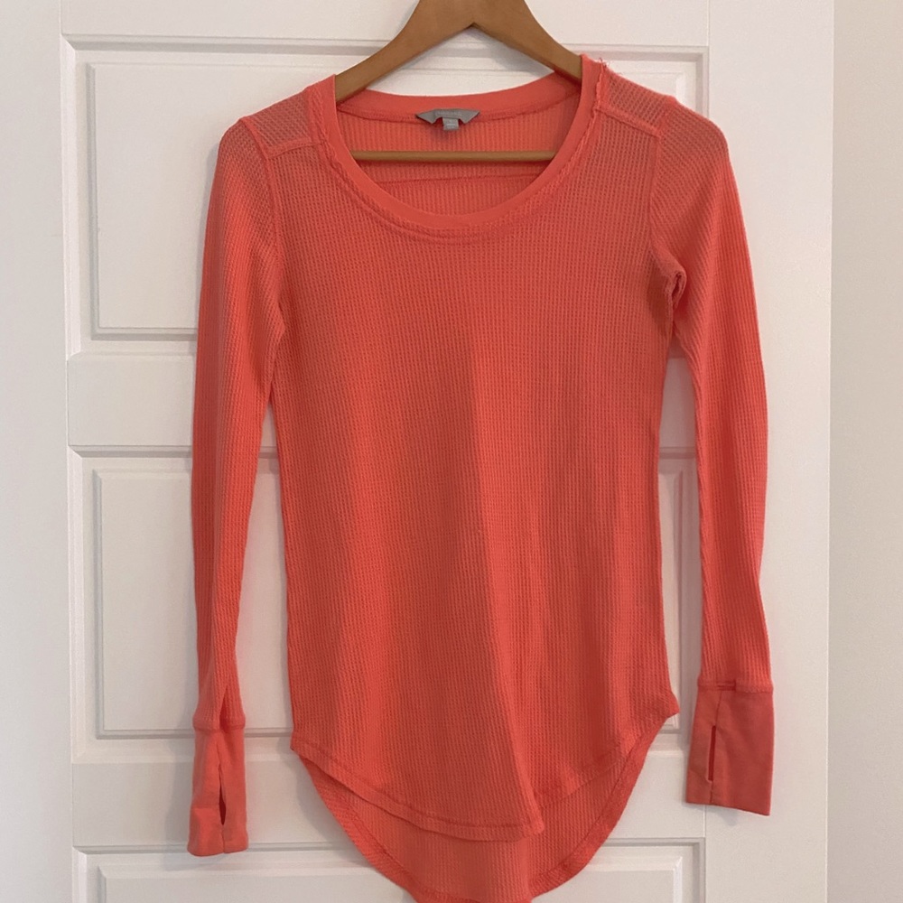 Long sleeve shirt with finger holes.